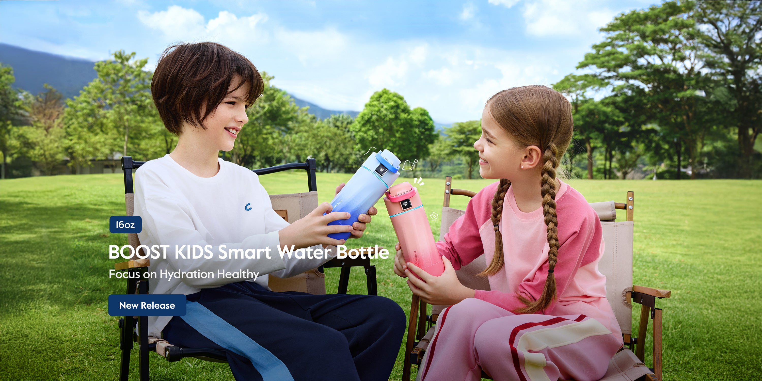 Two children sitting outdoors with Boost Kids Smart Water Bottles.
